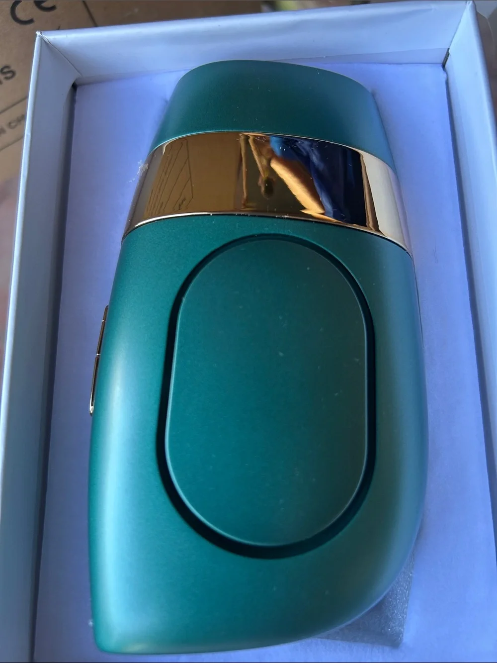 Teal and Gold Compact Hair Removal Accessory - Sleek Hair Styling Tool